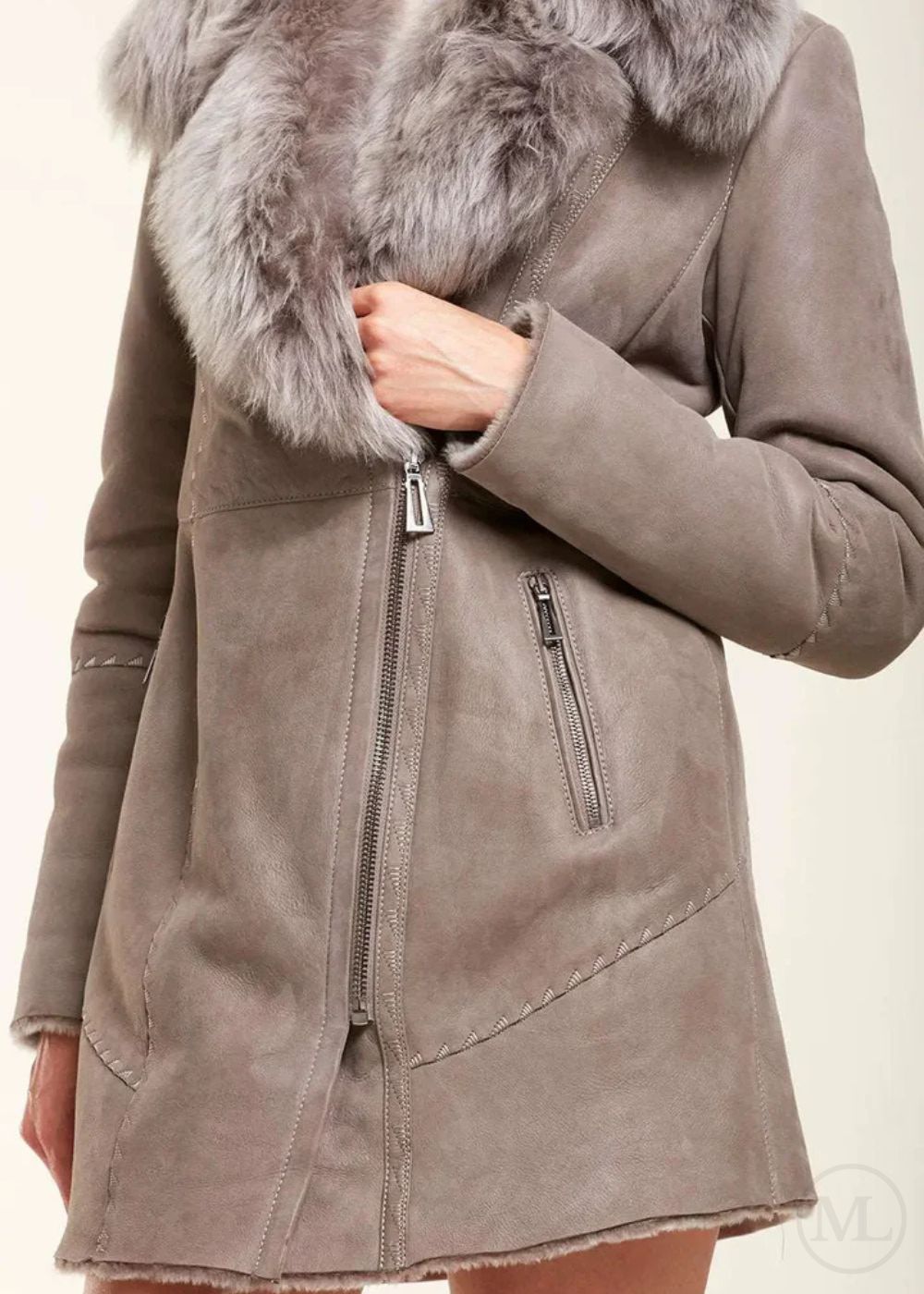Grey sheepskin coat with fur collar on a beige background