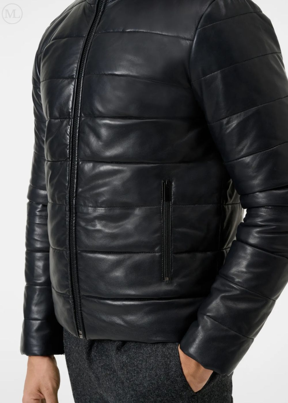 Black leather puffer jacket worn by a man on a white background