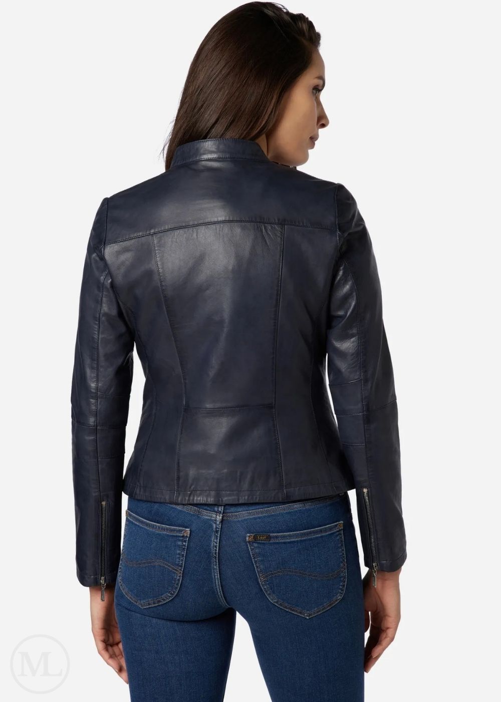 Woman wearing a blue leather jacket and blue jeans on a white background