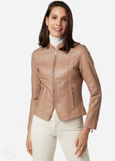 Woman wearing a taupe leather jacket on a white background