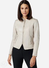 Woman wearing a white leather jacket on a white background