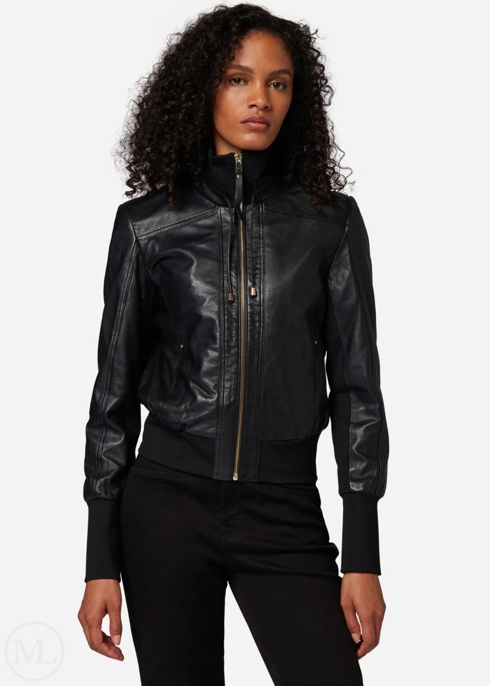 Woman wearing a black leather bomber jacket on a white background