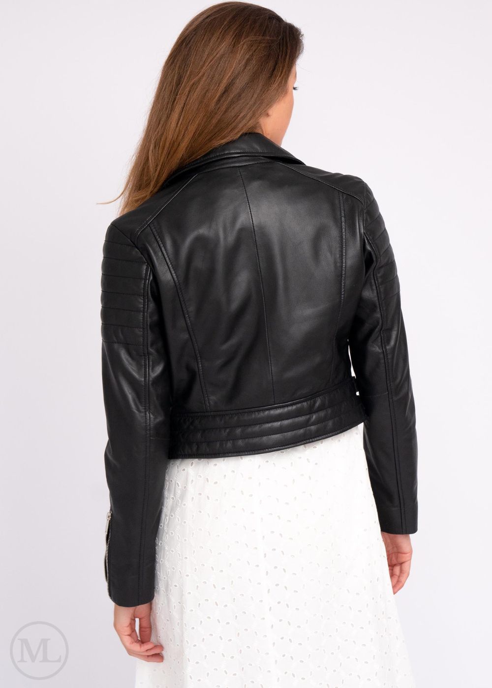 Women wearing a black leather biker jacket on a white background