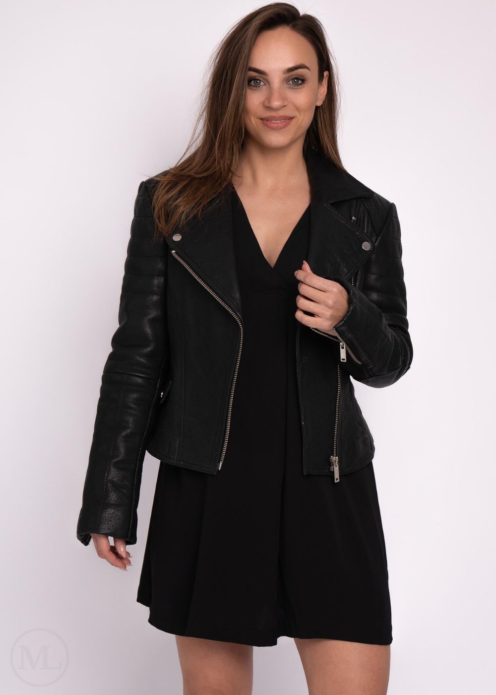 Woman wearing a black leather jacket on a white background