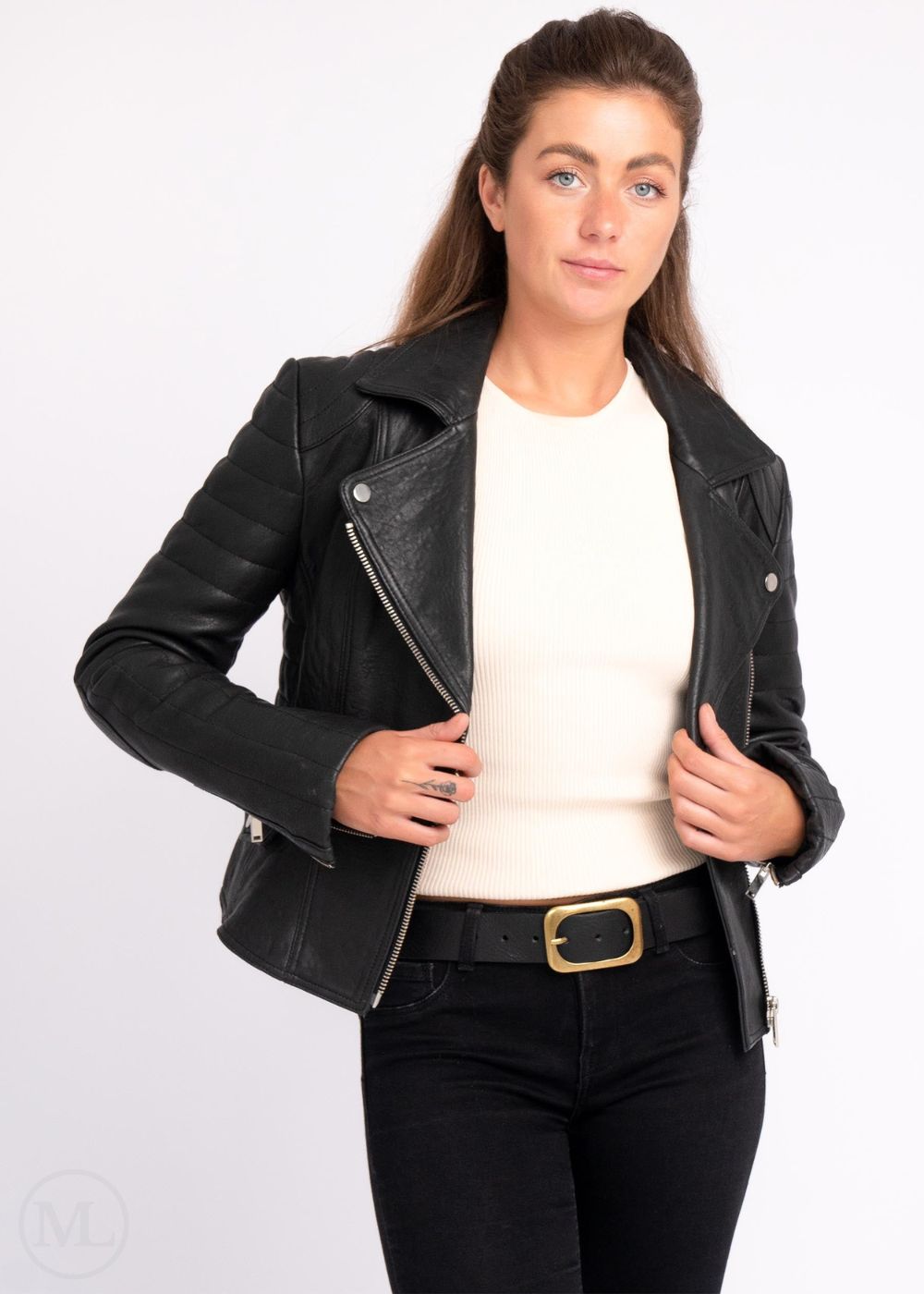 Woman wearing a black leather jacket on a white background