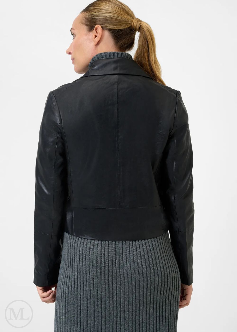 Women wearing a black leather blazer jacket on a white background