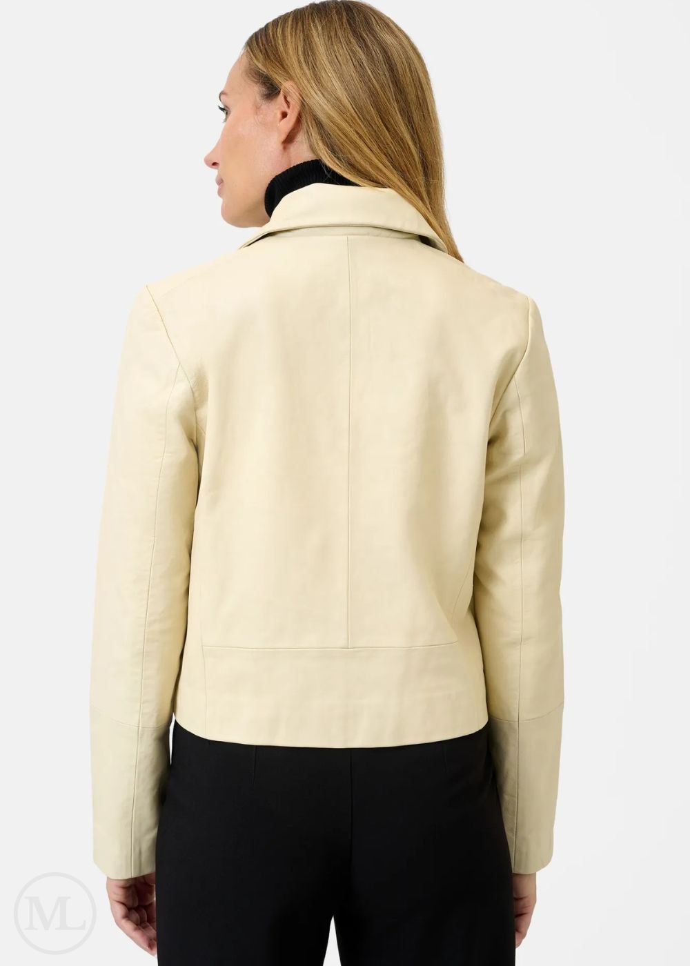 Woman wearing a lvory leather blazer jacket on a white background