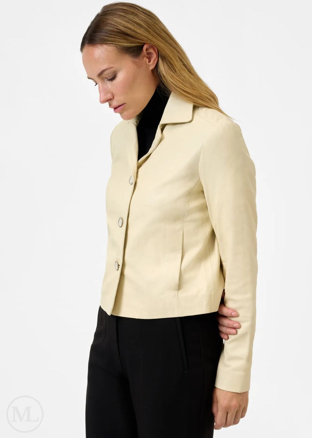 Woman wearing a lvory leather blazer jacket on a white background