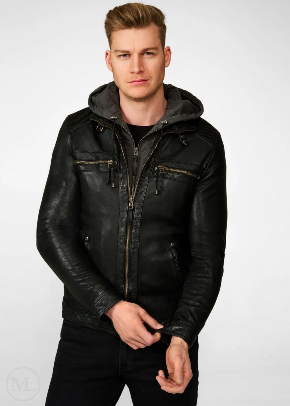 Man wearing a black leather jacket with a hood on a white background