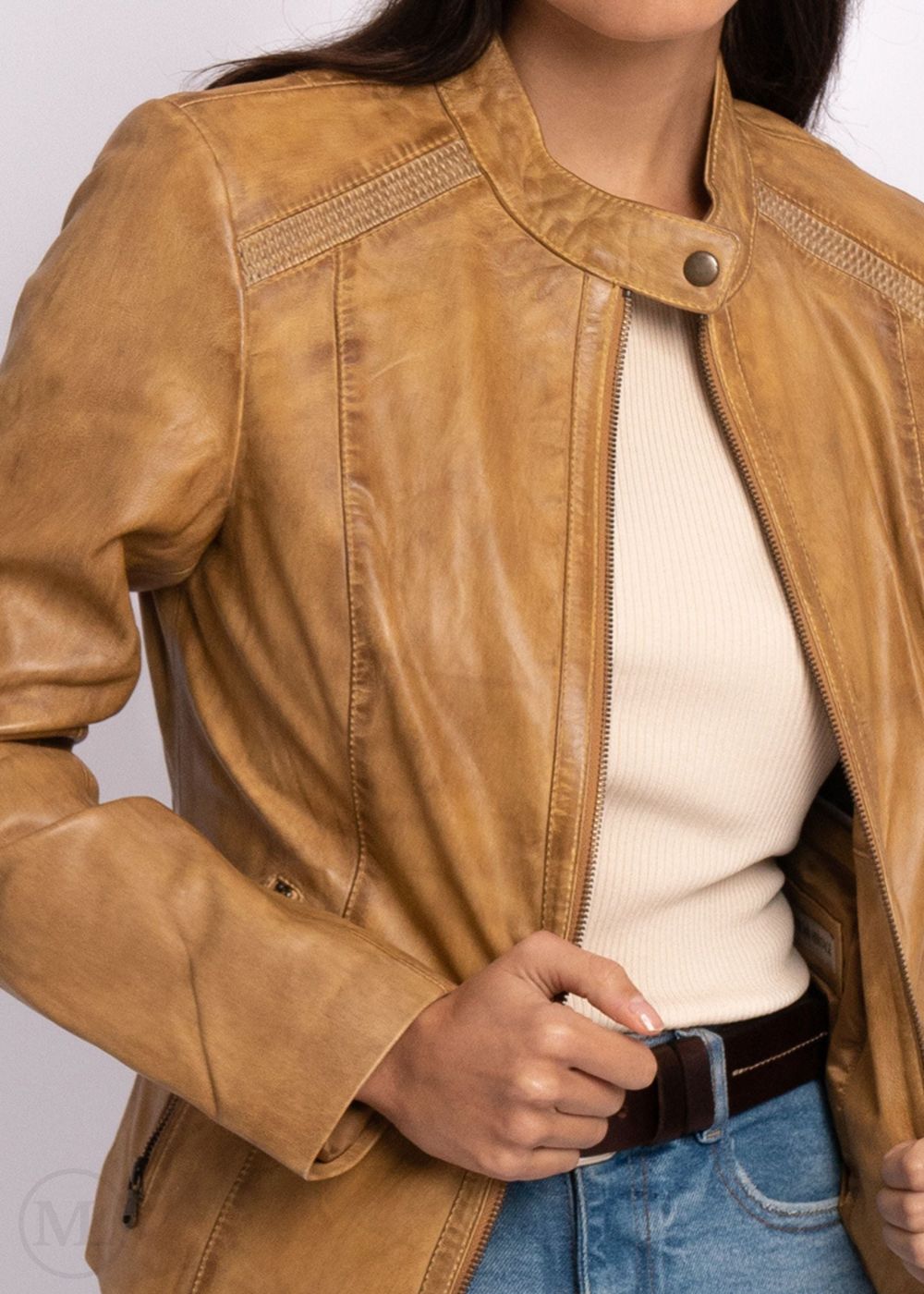 Camel leather biker jacket worn by a person on a white background