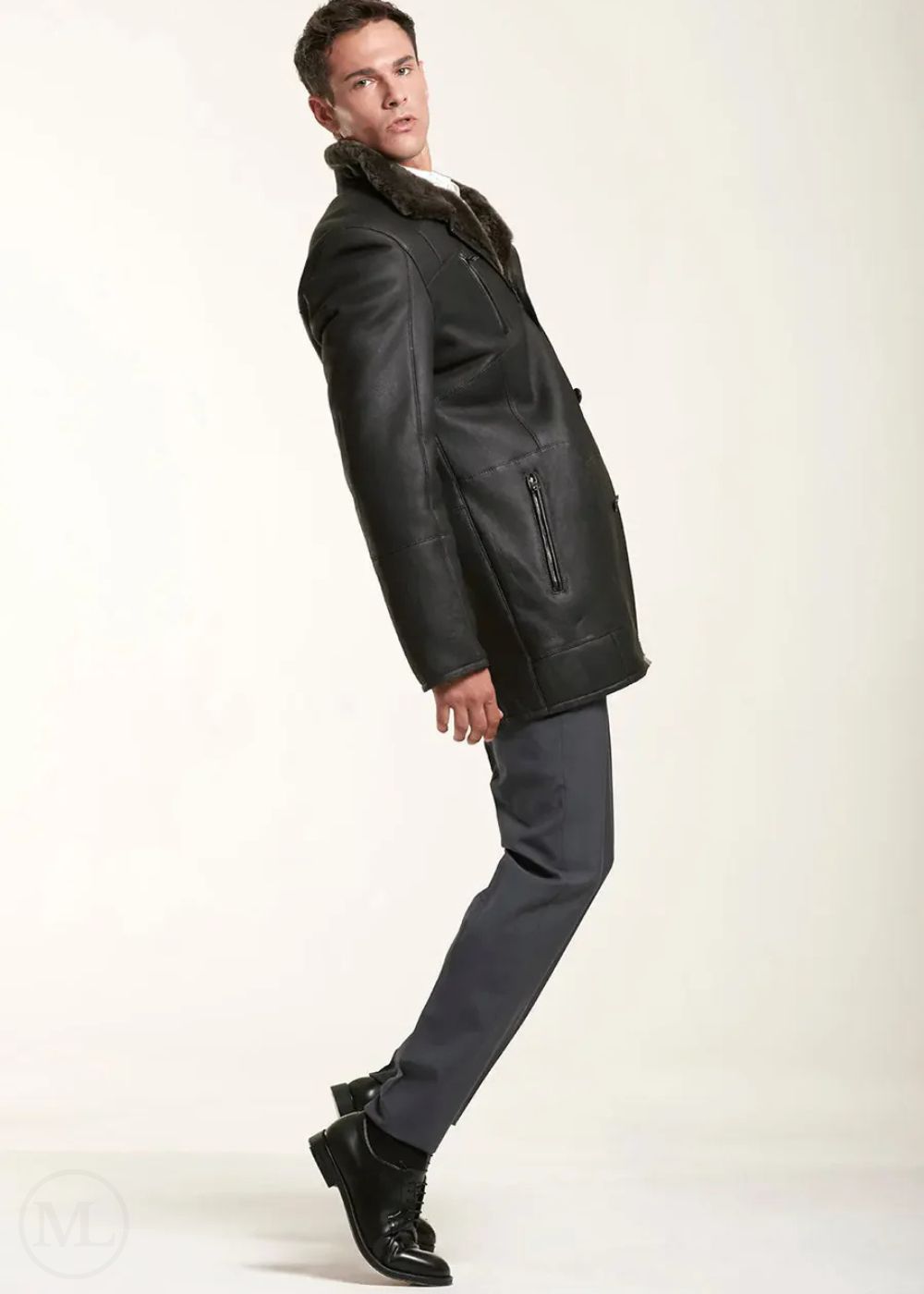 Man wearing a dark brown leather coat on a white background