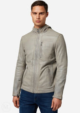 Man wearing a gray leather jacket on a white background