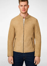 Man wearing a beige suede leather jacket on a white background