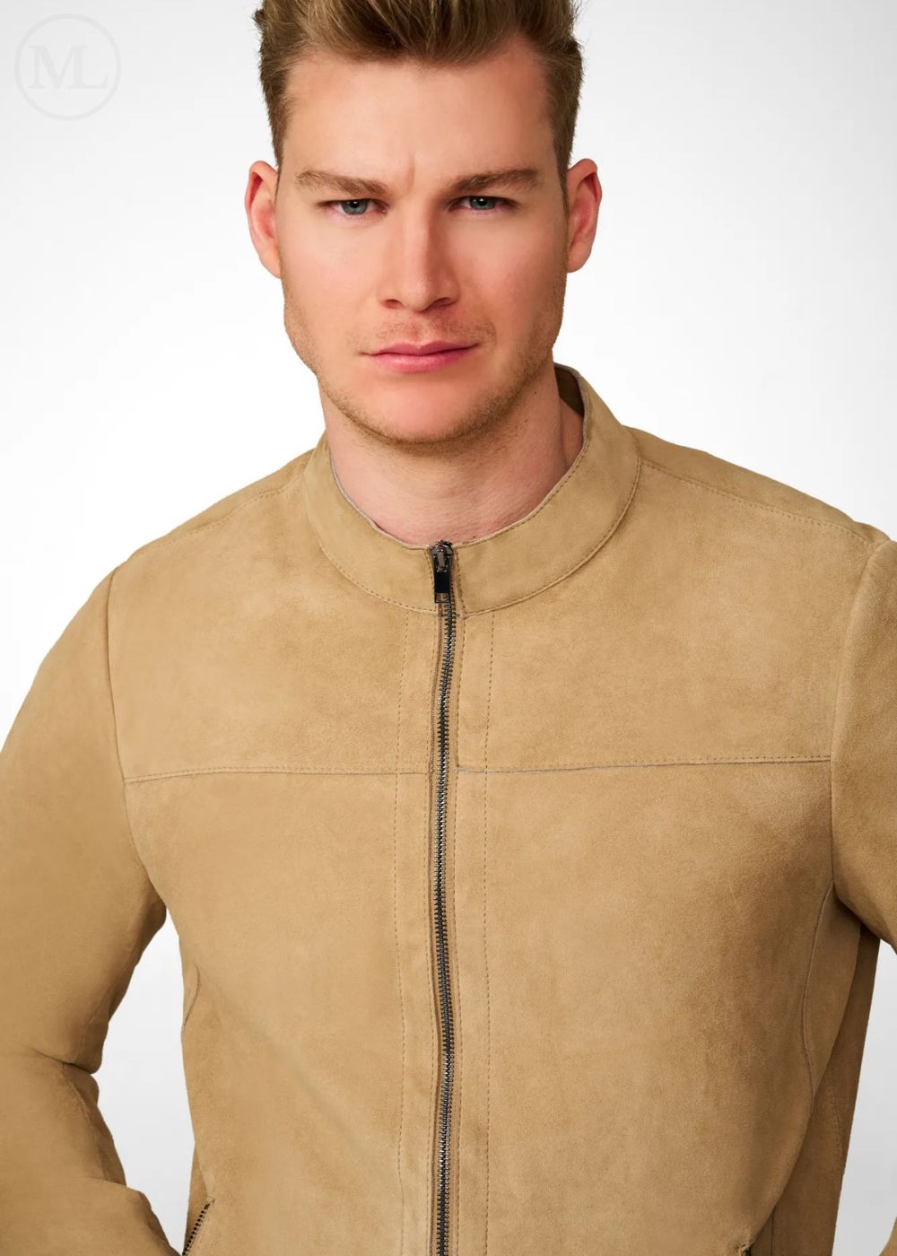 Man wearing a beige leather suede jacket against a white background