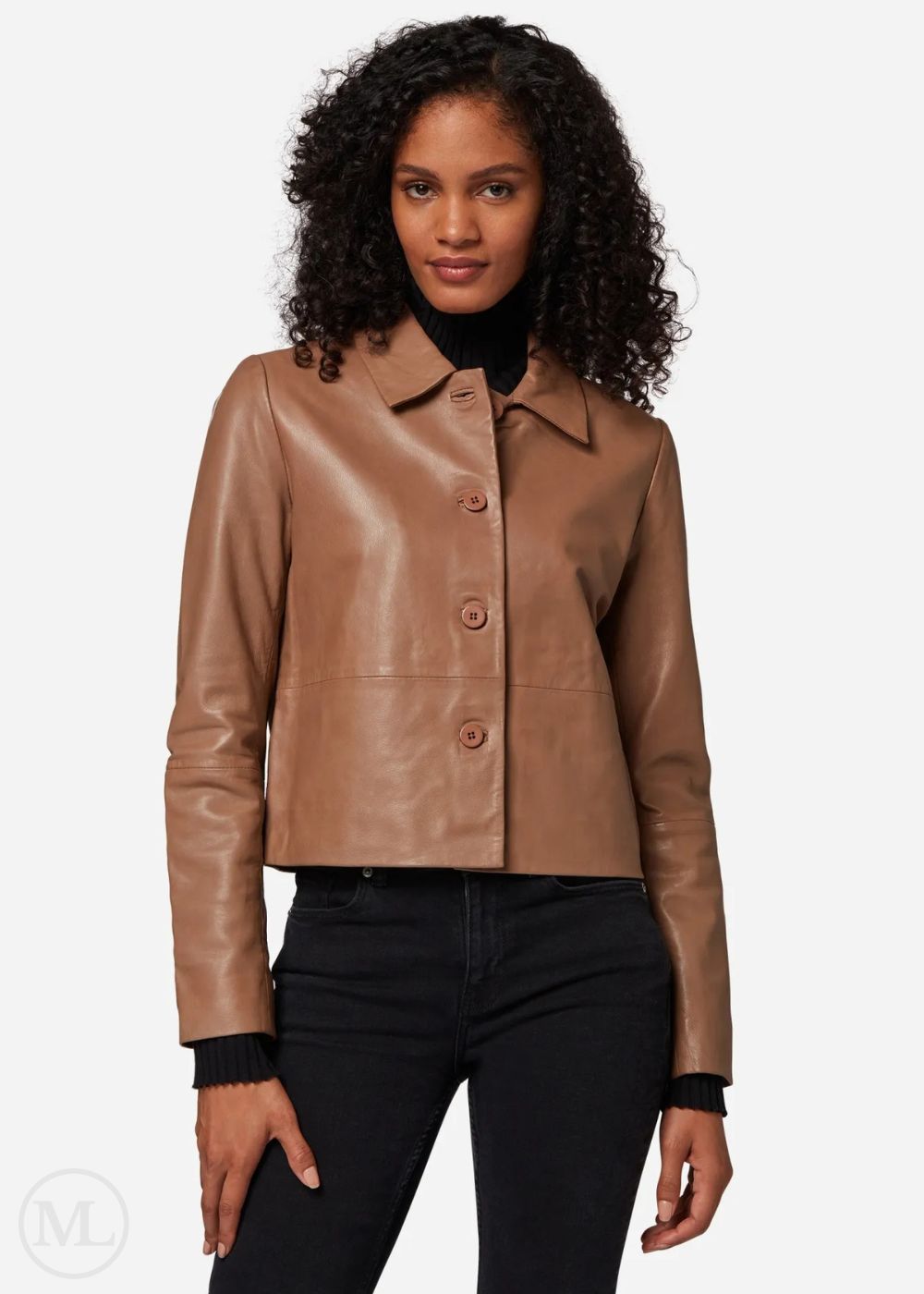 Woman wearing a camel leather cropped jacket on a white background