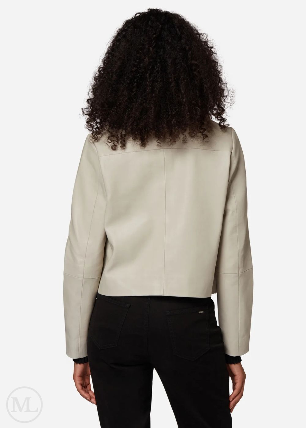 Women wearing a lvory leather cropped jacket on a white background