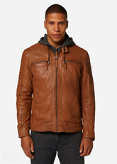 Man wearing a cognac brown leather jacket with a gray hoodie on a white background