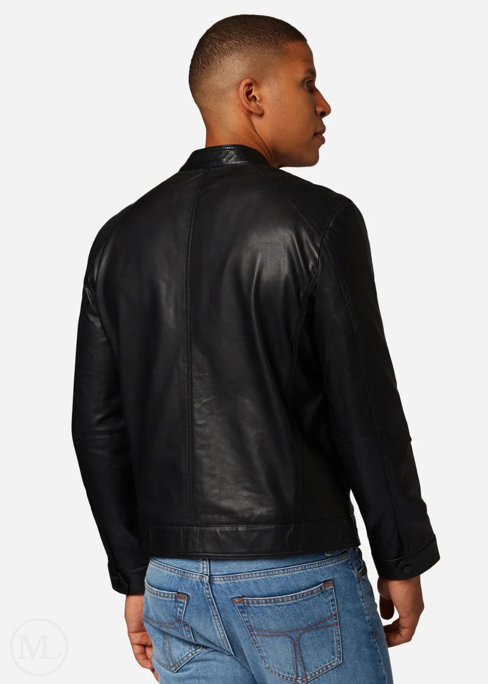 Man wearing a black leather jacket and blue jeans on a white background