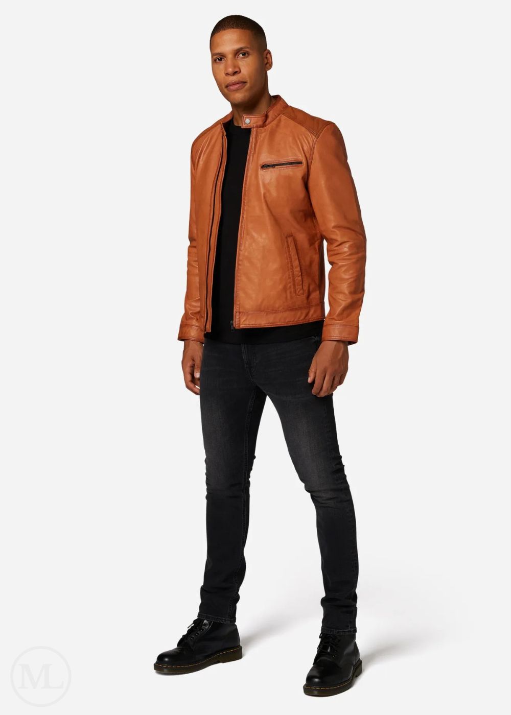 Man wearing a cognac brown leather jacket, black shirt, and jeans on a white background