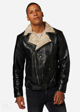 Man wearing a black leather jacket with a shearling collar on a white background