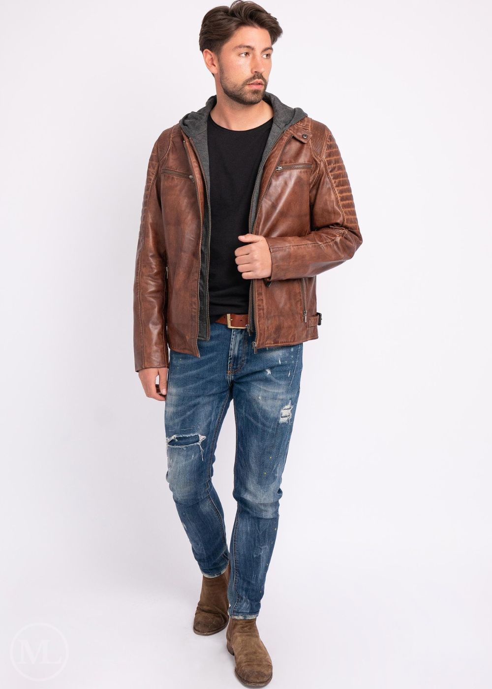 Man wearing a brown leather Motorcycle jacket and jeans on a white background