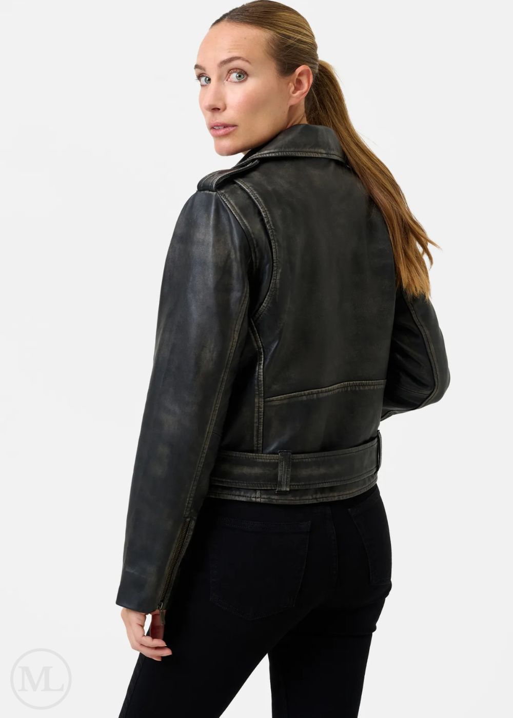 Woman wearing a black leather biker jacket on a white background