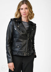 Woman wearing a black leather biker jacket on a white background