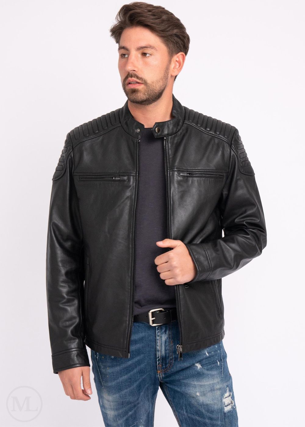 Man wearing a black leather jacket and blue jeans on a white background