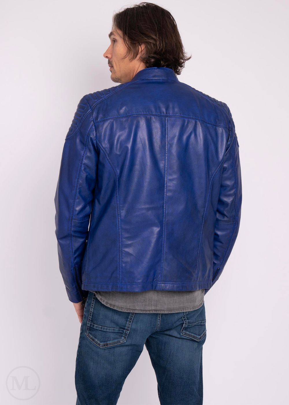 Man wearing a blue leather jacket on a white background