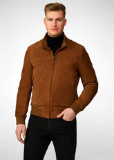 Man wearing a brown suede bomber jacket on a white background