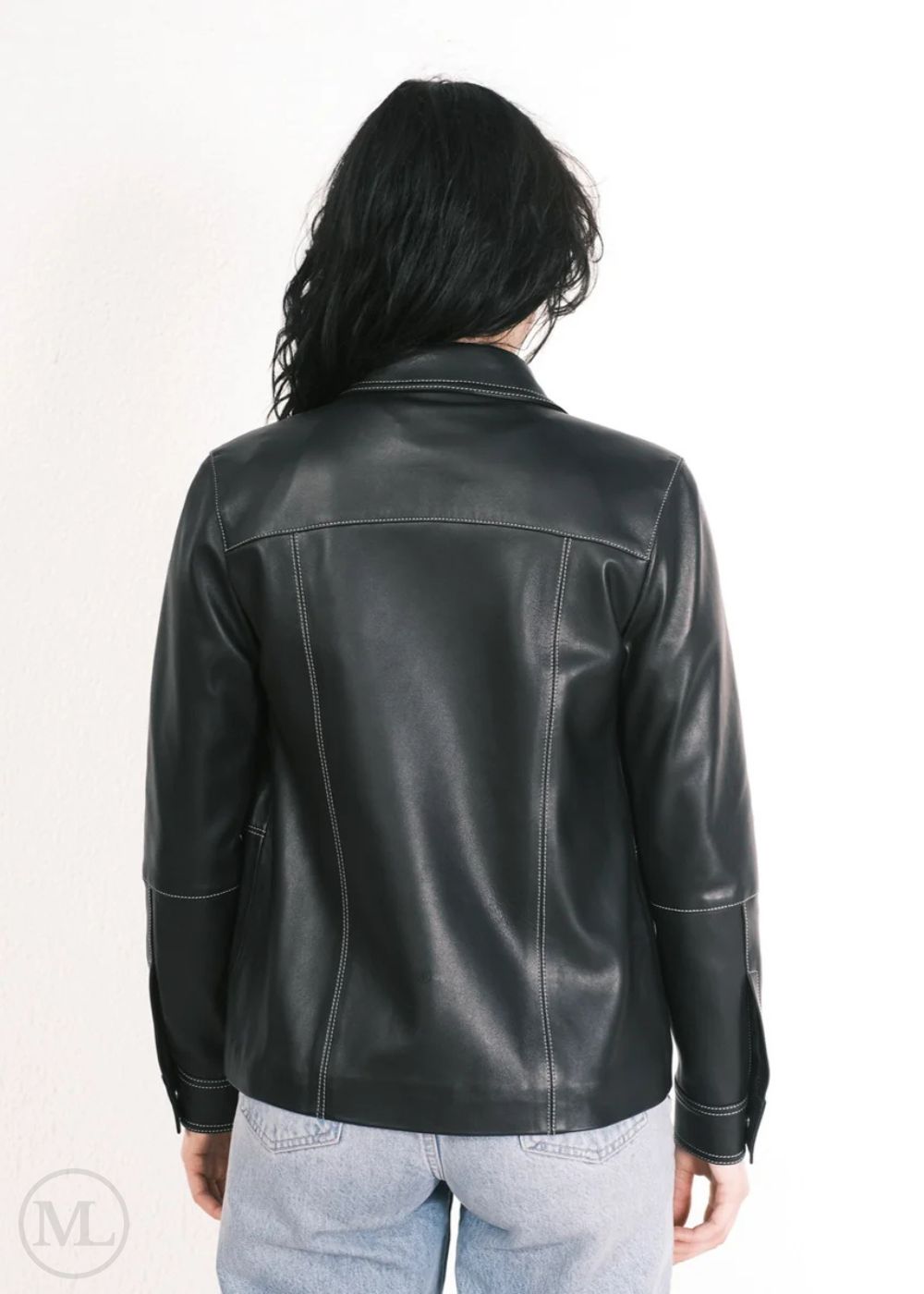Women wearing a black leather jacket on a white background