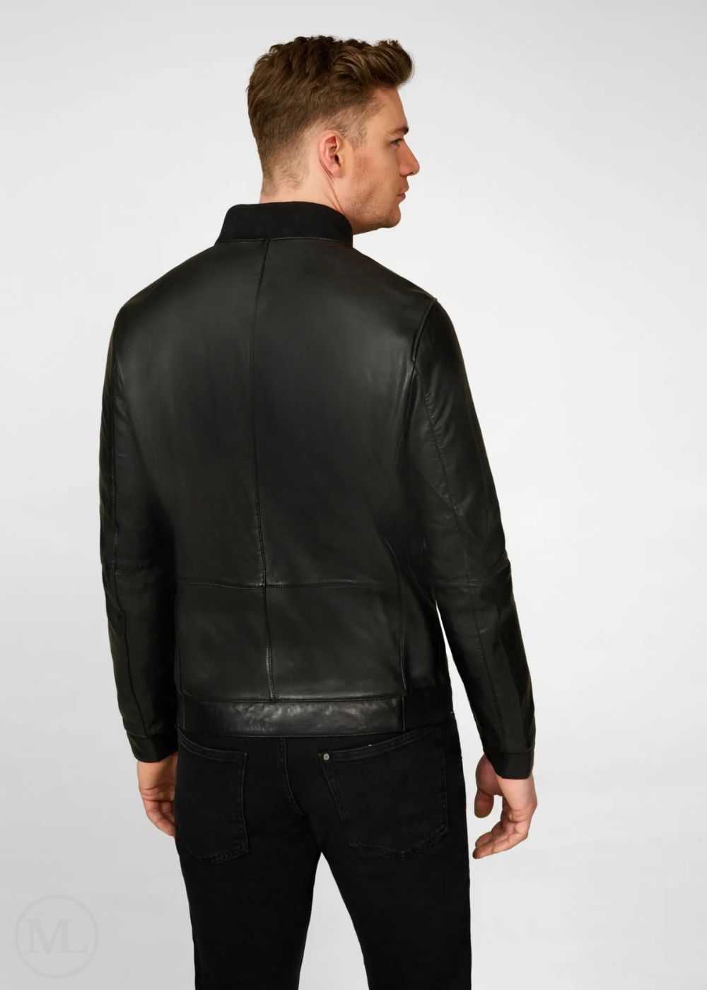 Man wearing a black leather bomber jacket on a white background
