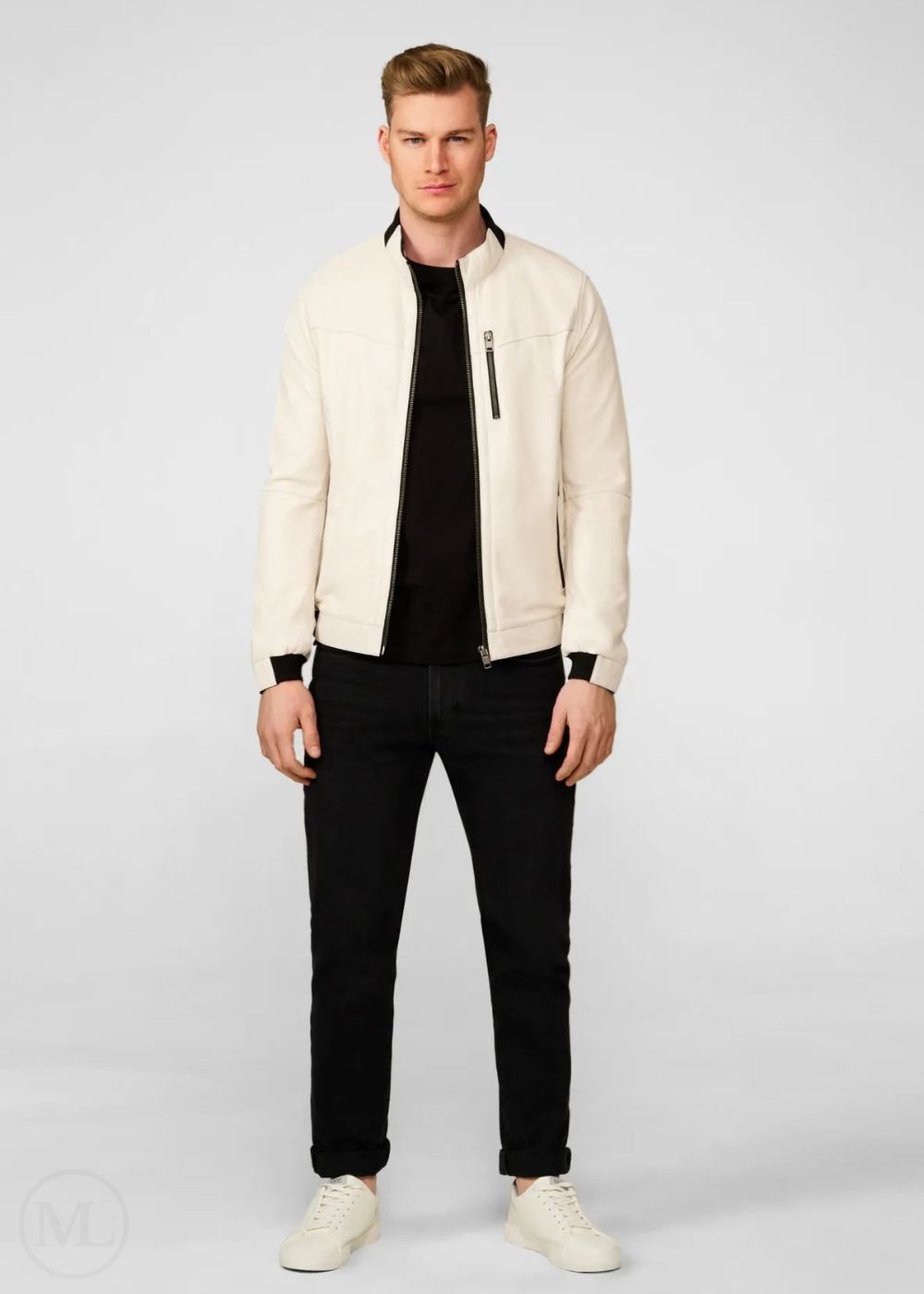 Man wearing a white leather bomber jacket, black shirt, and jeans on a white background
