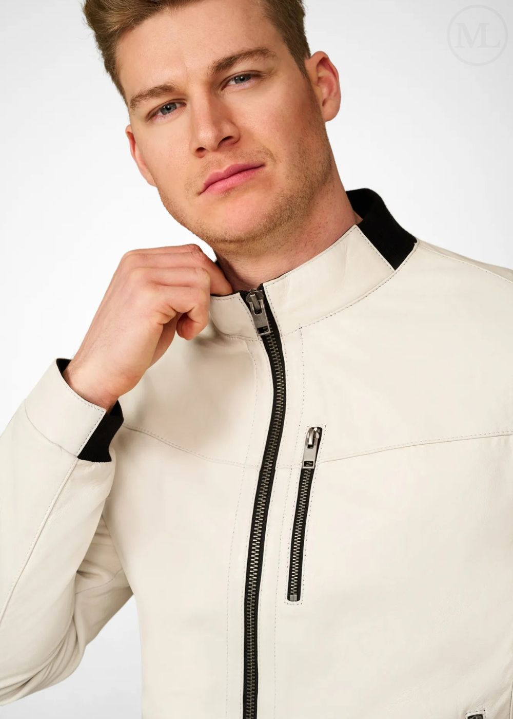 Man wearing a white leather bomber jacket with black accents on a white background