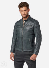 Man wearing a grey leather biker jacket on a white background