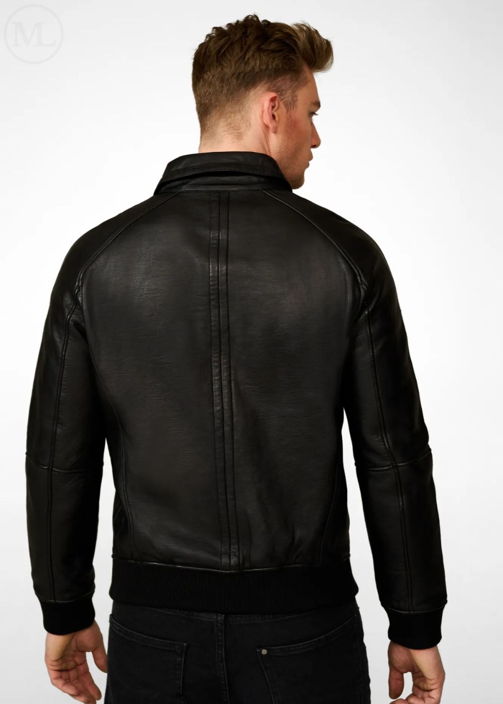 Man wearing a black leather bomber jacket on a white background