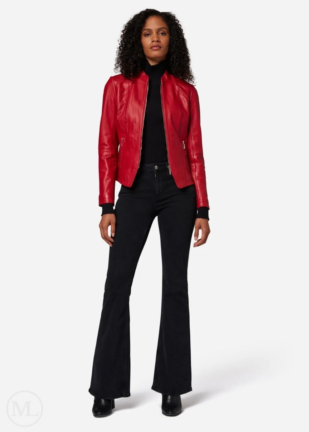Woman wearing a red leather jacket, black turtleneck, and black flared jeans on a white background