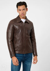 Man wearing a dark brown leather racer jacket on a white background