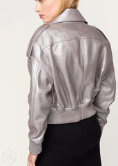 Silver leather bomber jacket worn by a person on a light gray background
