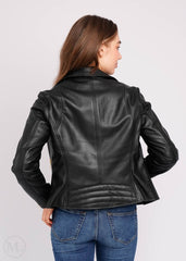 Women wearing a black leather biker jacket on a white background