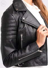 Black leather biker jacket with zippers on a white background