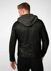 Man wearing a black leather jacket with a hood on a white background