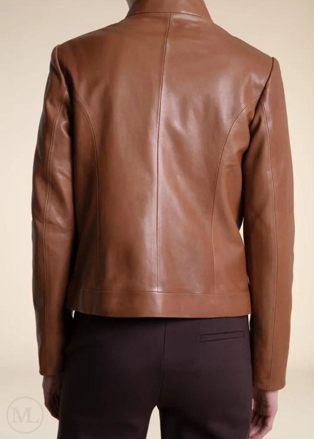 Brown leather moto jacket on a beige background