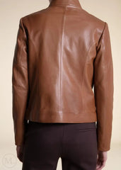 Brown leather moto jacket on a beige background