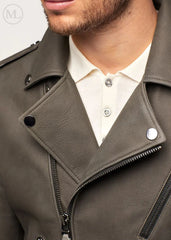 Close-up of a olive khaki leather biker jacket with a white shirt underneath