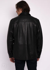 Man wearing a black leather jacket on a white background