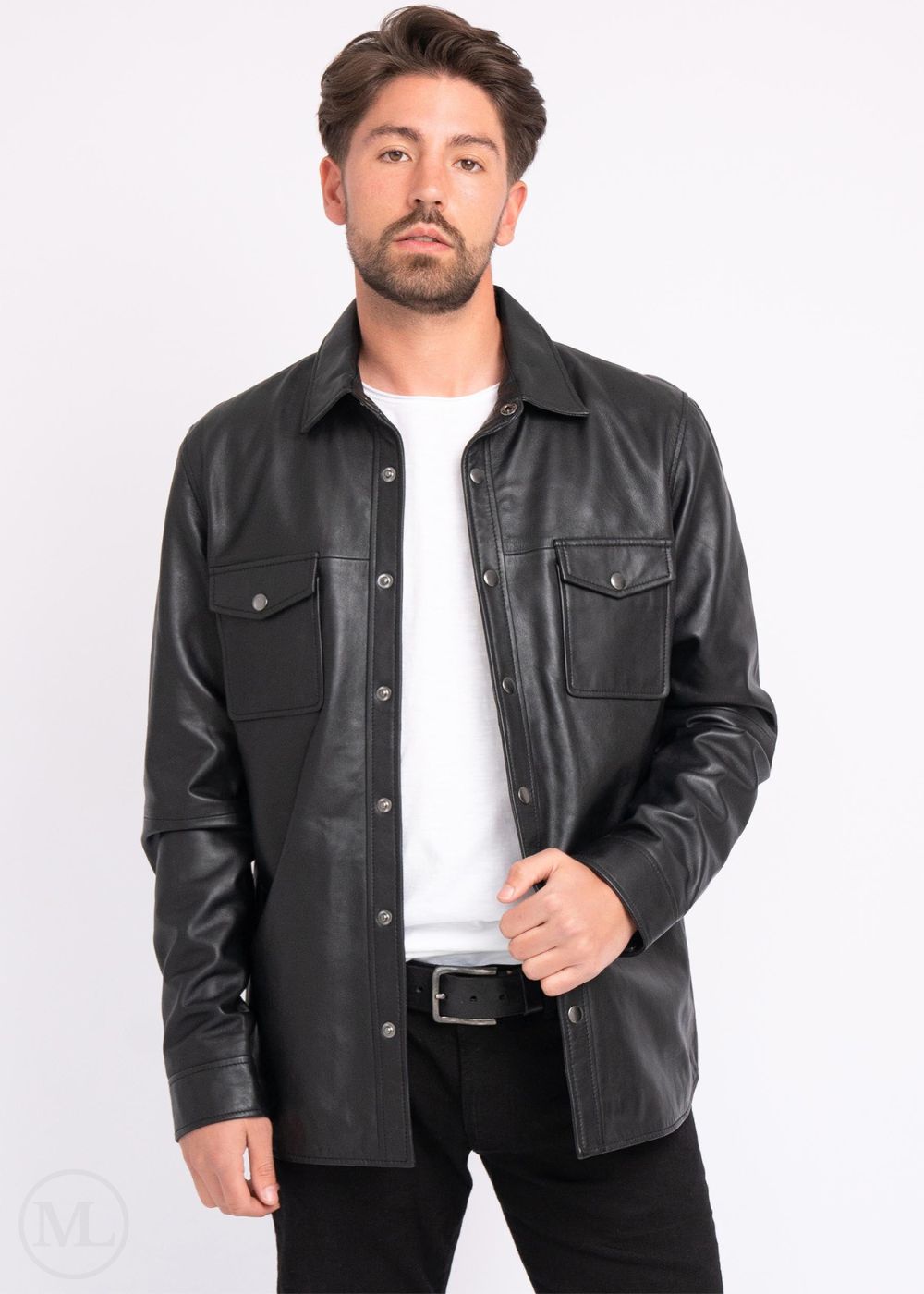 Man wearing a black leather jacket over a white shirt on a white background