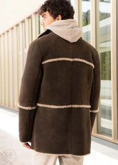 Men wearing a brown suede shearling coat with beige trim in an indoor setting.