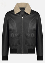 Black bomber leather jacket with beige shearling collar on a light gray background
