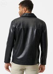 Man wearing a black leather coat on a white background
